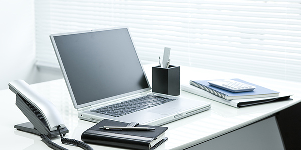 Desk with a laptop computer.